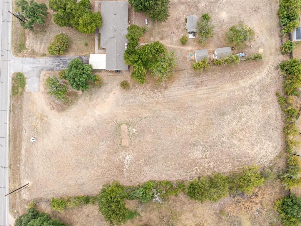 1835 North Main Street Weatherford, TX 76085 - Photo 6 of 7 an aerial view of a house with a yard