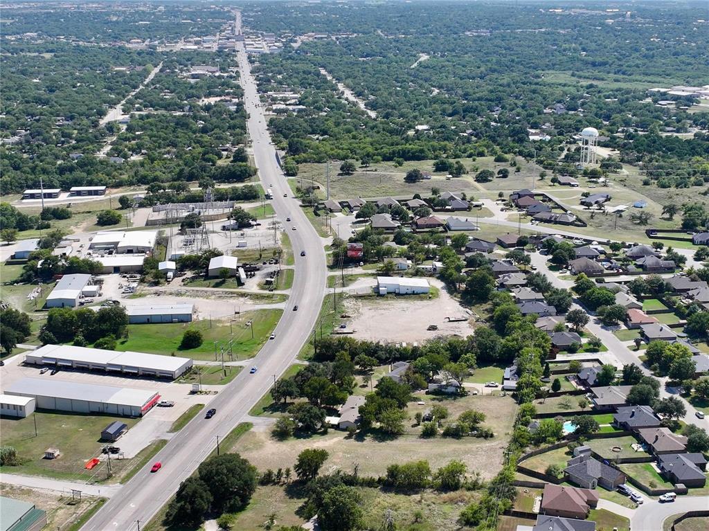 1835 North Main Street Weatherford, TX 76085 - Photo 7 of 7 an aerial view of residential houses with outdoor space and parking