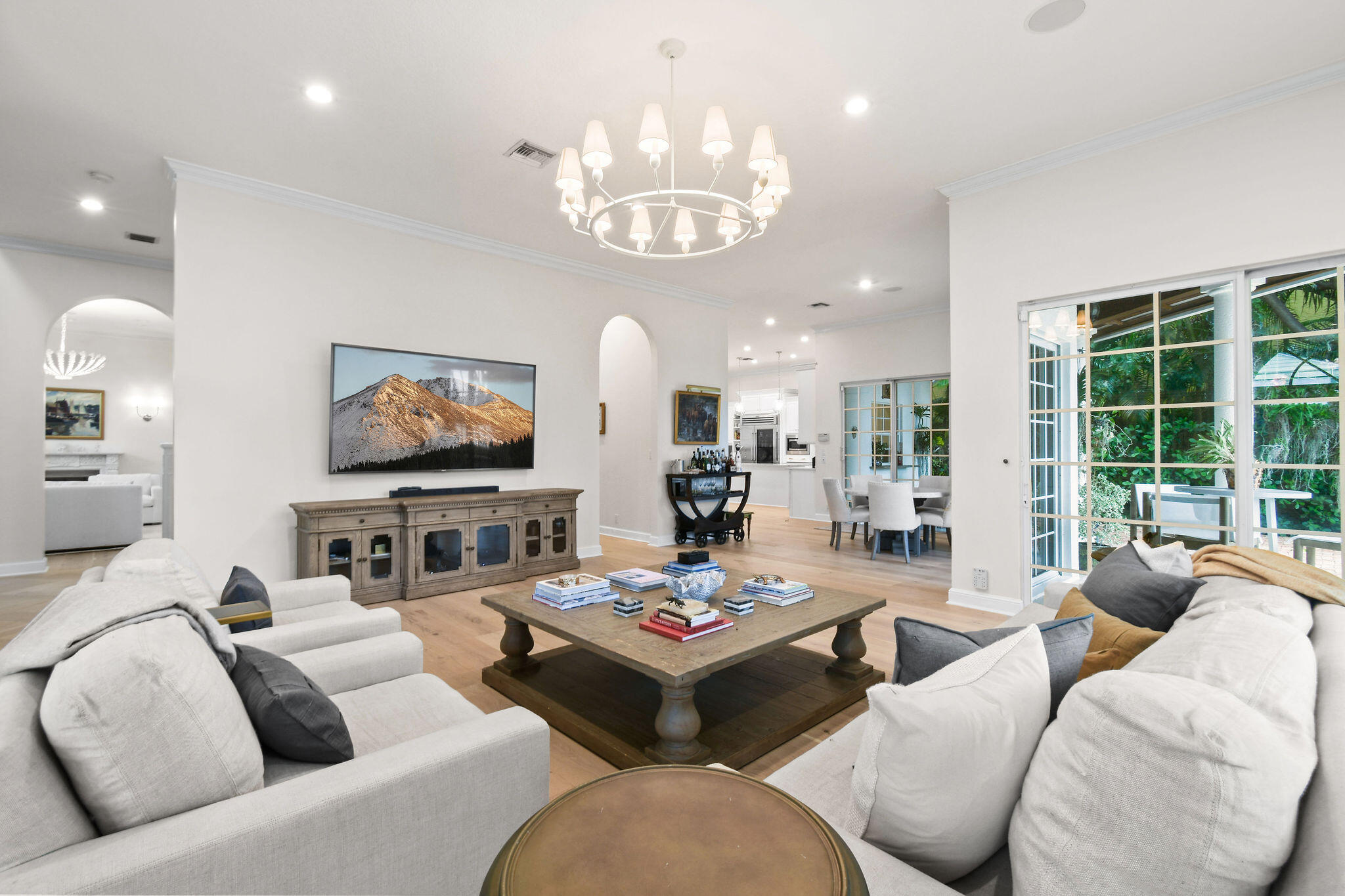 201 Avila Road West Palm Beach, FL 33405 - Photo 13 of 75 a living room with furniture chandelier and a large mirror