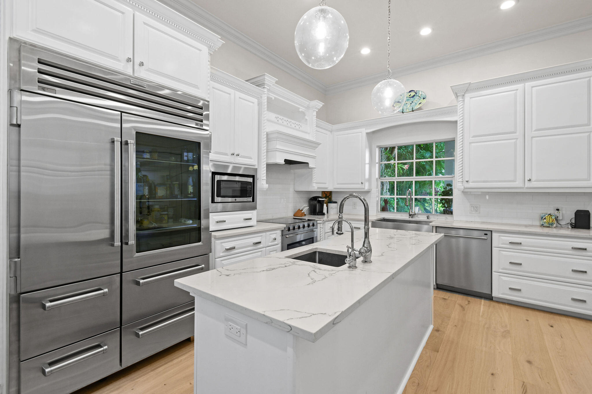 201 Avila Road West Palm Beach, FL 33405 - Photo 17 of 75 a kitchen with cabinets and stainless steel appliances