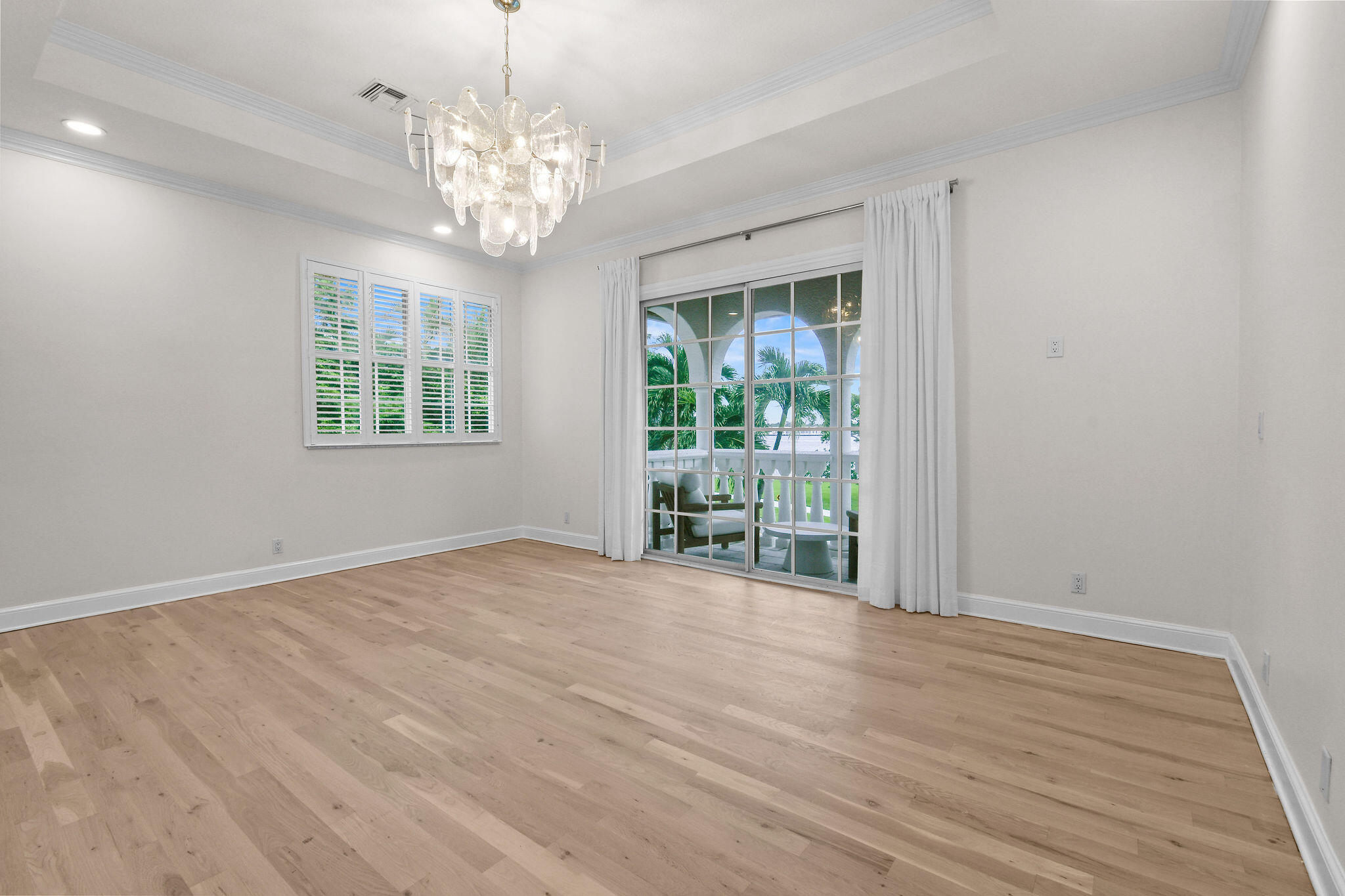 201 Avila Road West Palm Beach, FL 33405 - Photo 28 of 75 a view of an empty room with wooden floor and potted plant