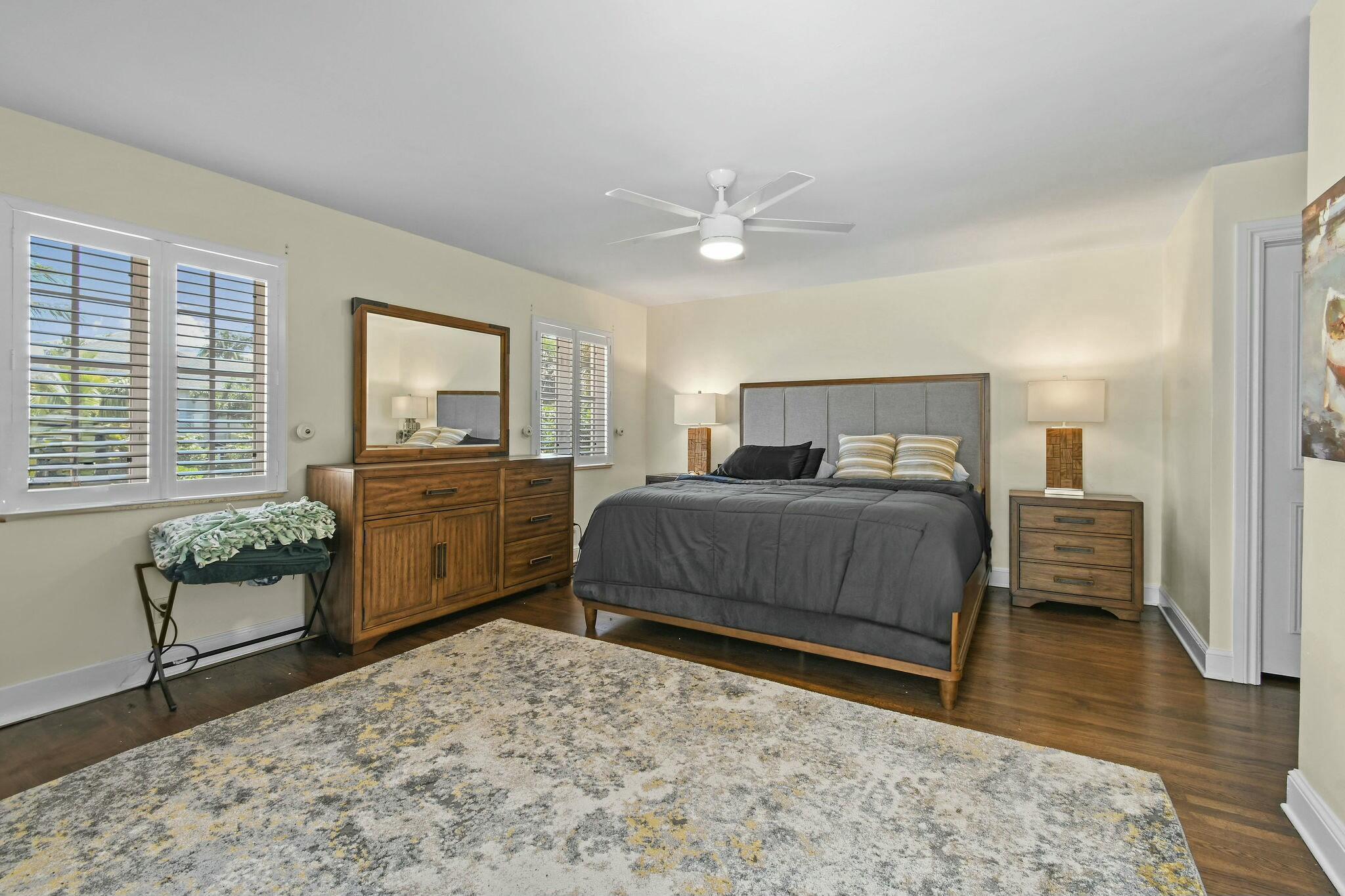 201 Avila Road West Palm Beach, FL 33405 - Photo 70 of 75 a bedroom with a bed and dresser with wooden floor