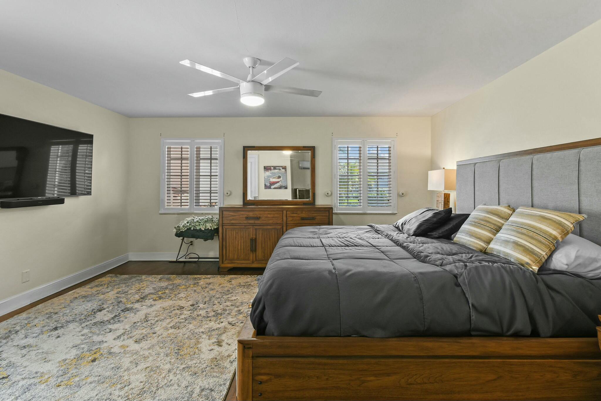 201 Avila Road West Palm Beach, FL 33405 - Photo 71 of 75 a spacious bedroom with a bed and a flat screen tv