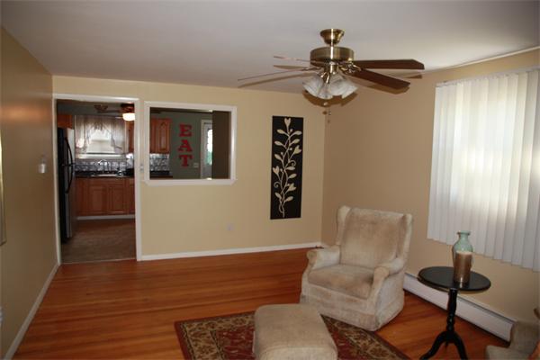 297 Morgan Road West Springfield, MA 01089 - Photo 3 of 19 a view of livingroom and dining room with furniture window and wooden floor