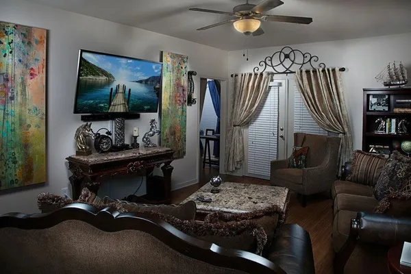 a living room with furniture and a flat screen tv