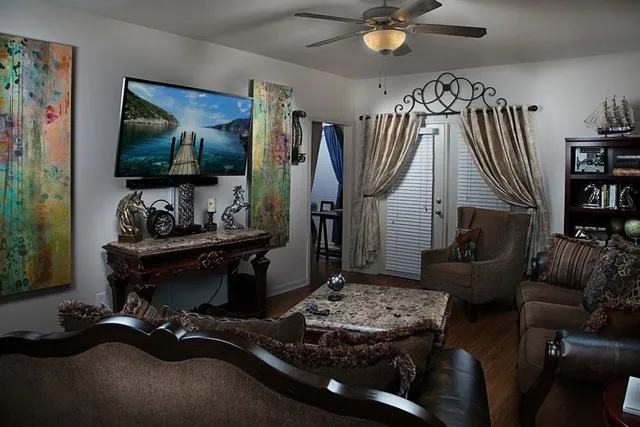 a living room with furniture and a flat screen tv