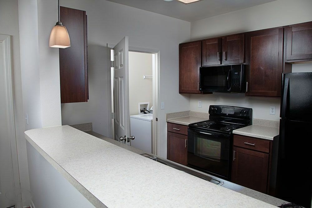 3400 McCullough Boulevard Belden, MS 38826 - Photo 8 of 15 a kitchen with a refrigerator stove and microwave