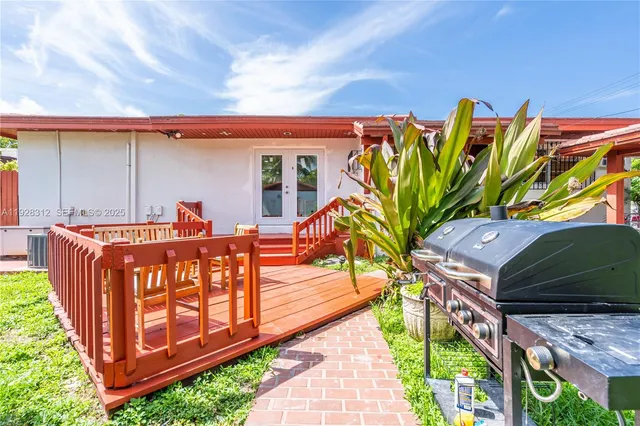 a view of a chairs and table in a backyard