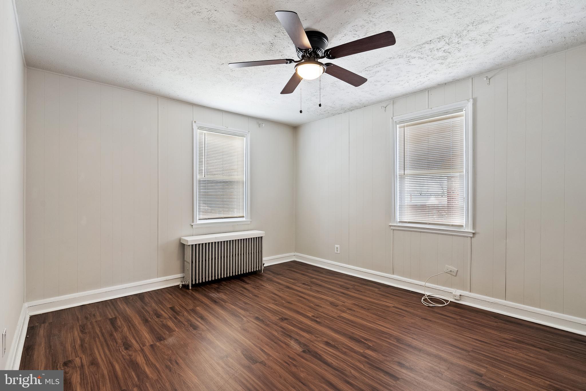 1617 Northwick Road Baltimore, MD 21218 - Photo 18 of 32 a room with window and wooden floor