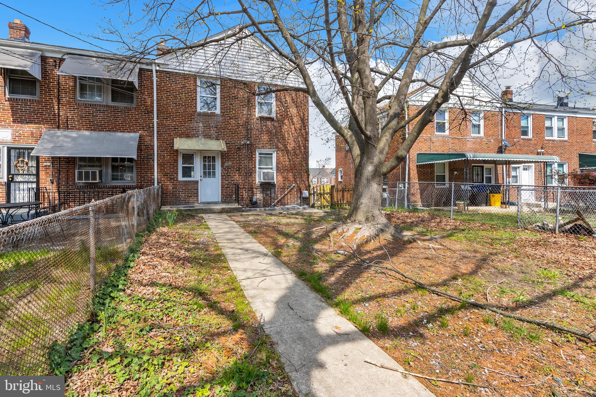 1617 Northwick Road Baltimore, MD 21218 - Photo 25 of 32 a front view of a house with a yard