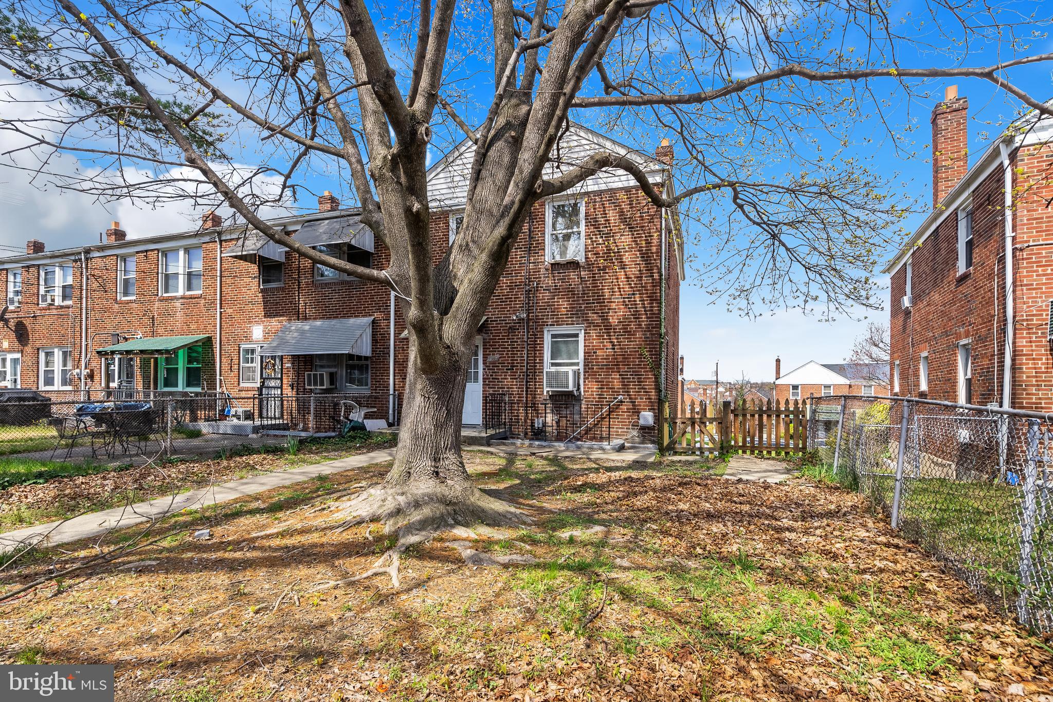 1617 Northwick Road Baltimore, MD 21218 - Photo 28 of 32 a view of a house with a trees in the background