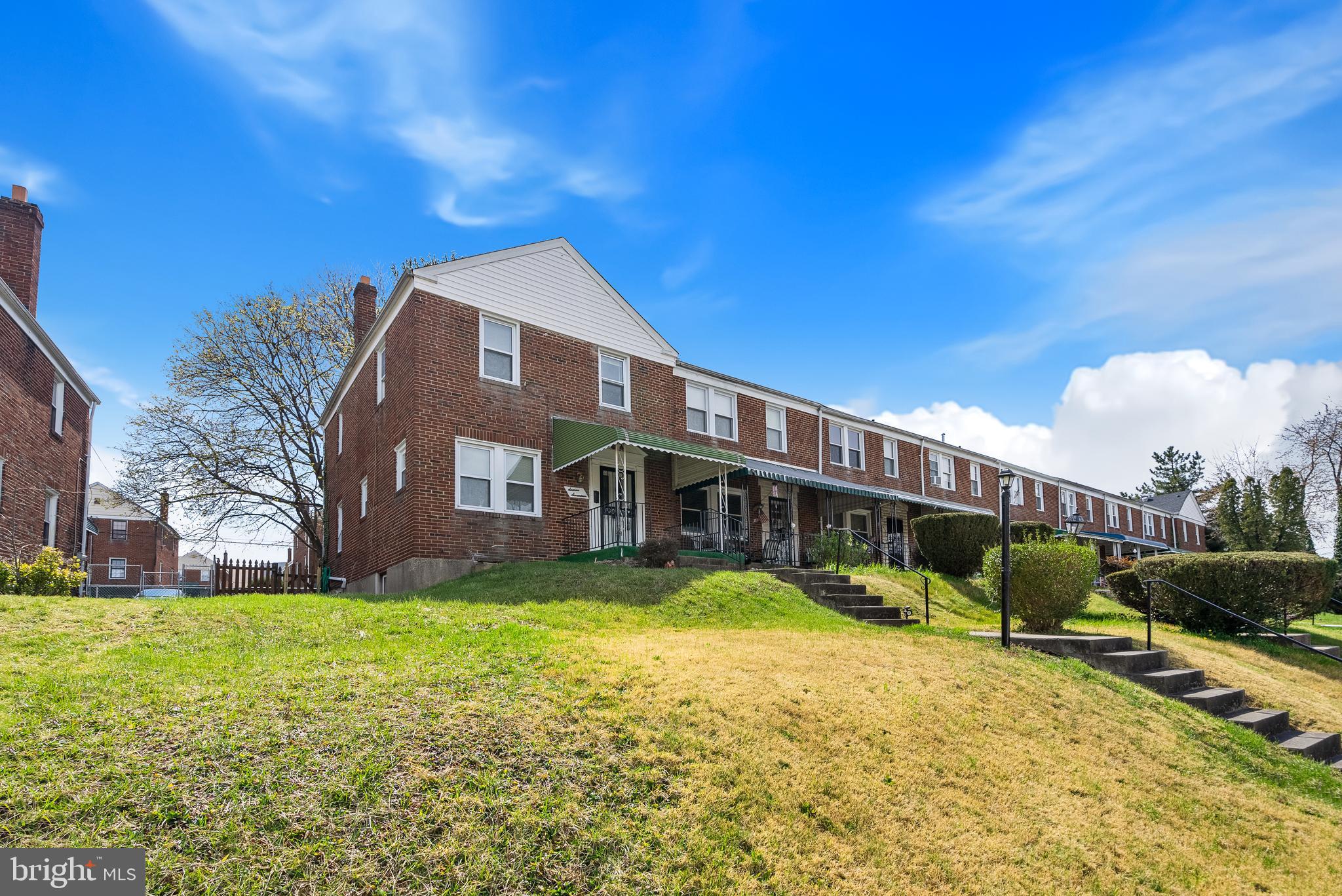 1617 Northwick Road Baltimore, MD 21218 - Photo 29 of 32 a view of a house with a yard