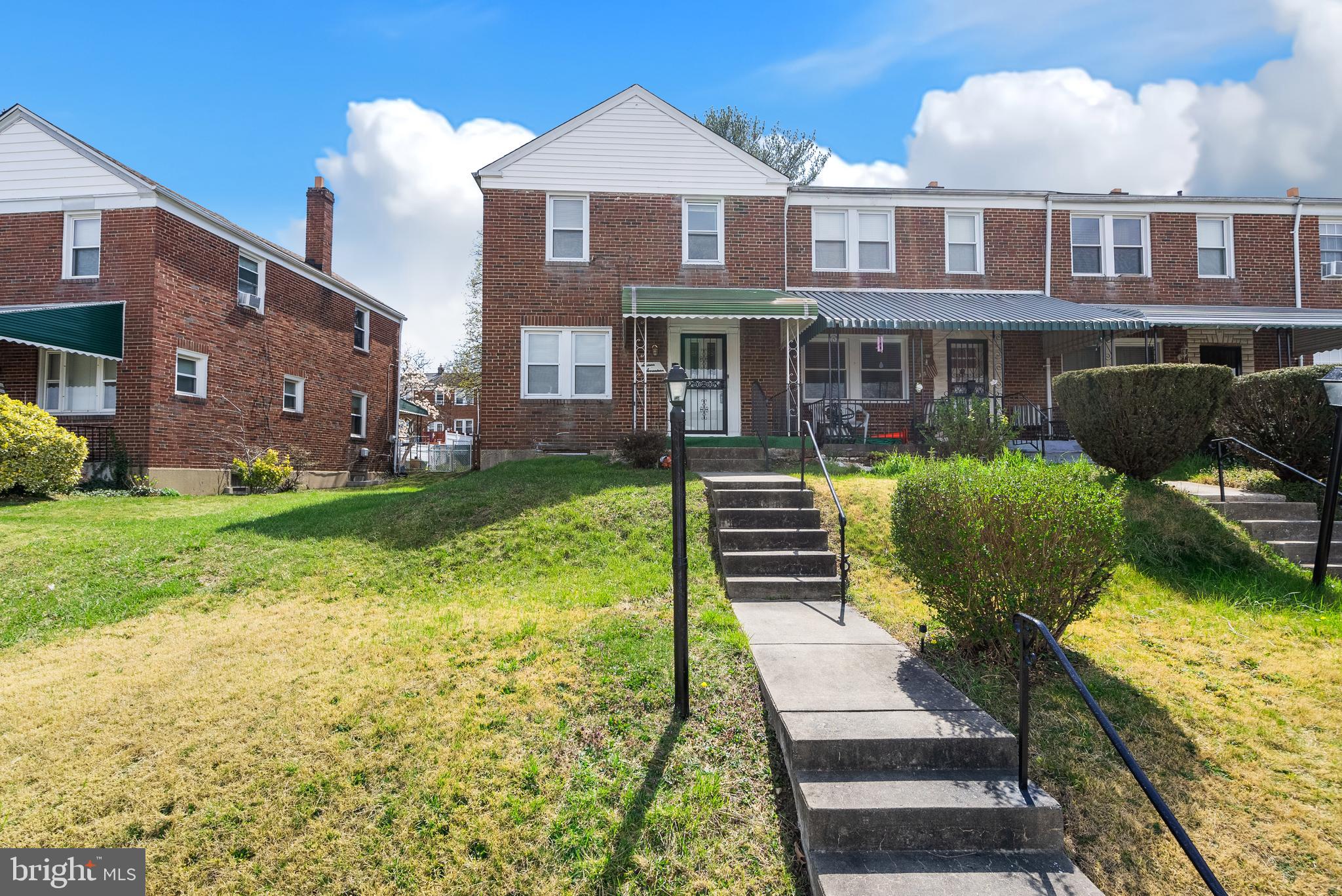 1617 Northwick Road Baltimore, MD 21218 - Photo 3 of 32 a front view of a building with garden