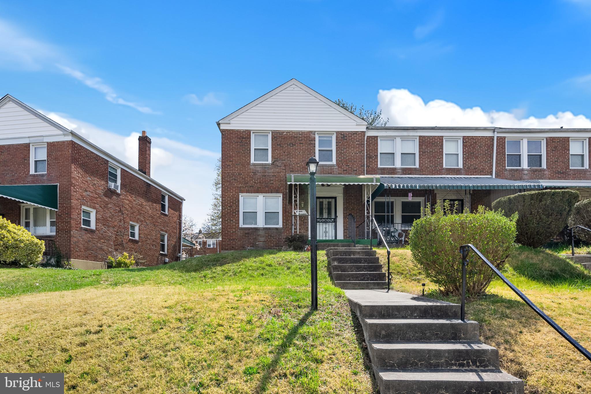 1617 Northwick Road Baltimore, MD 21218 - Photo 31 of 32 a front view of a house with garden