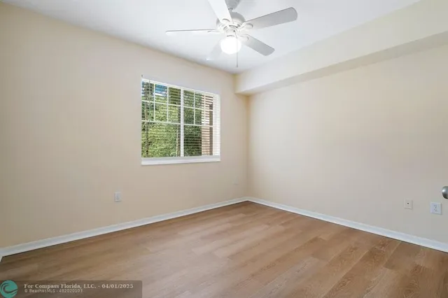 an empty room with wooden floor
