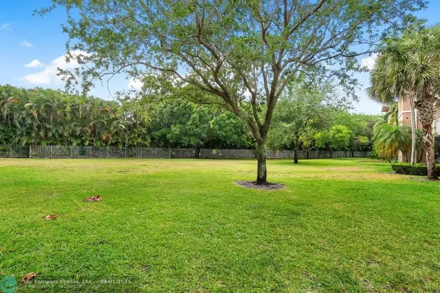 an aerial view of a house with garden space table and chairs