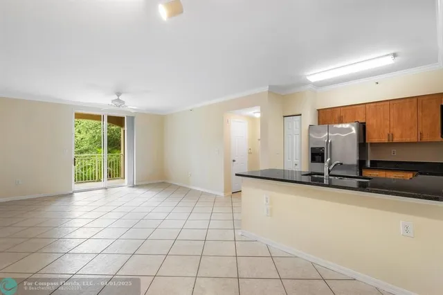 a view of a kitchen with a sink and a window