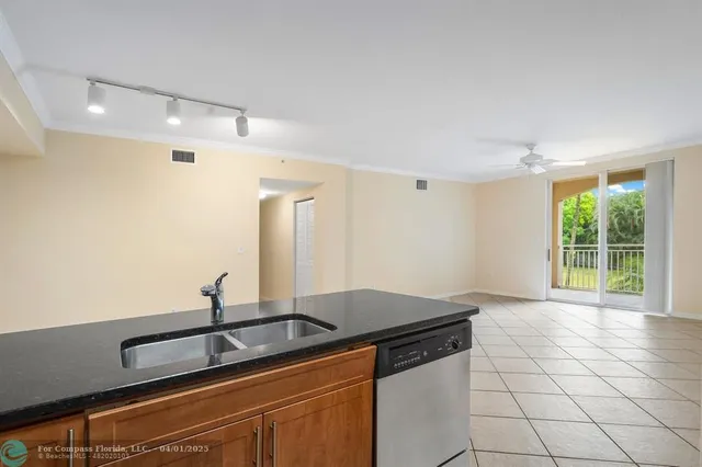 a kitchen with a sink and a window