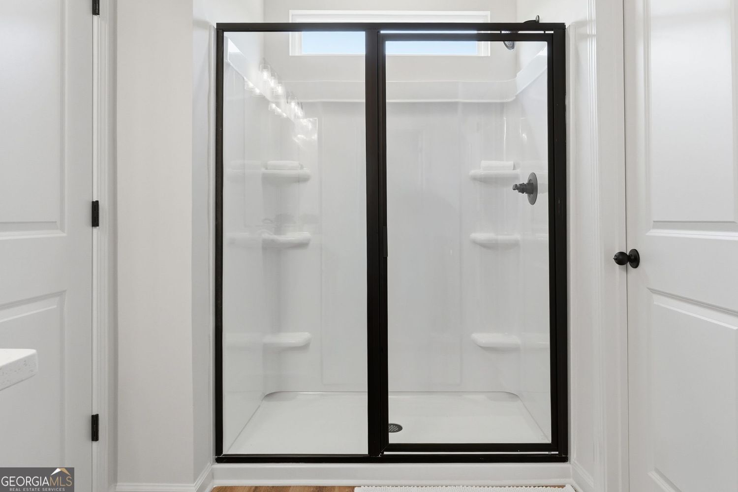 411 Summit View Lane, Unit 2 Jasper, GA 30143 - Photo 26 of 38 a bathroom with a glass shower door