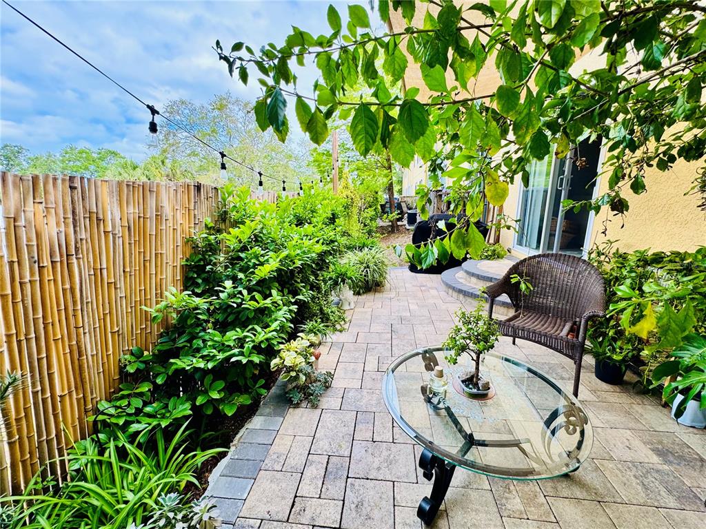 1116 Sunset Point Road, Unit 202 Clearwater, FL 33755 - Photo 30 of 31 a garden view with a seating space