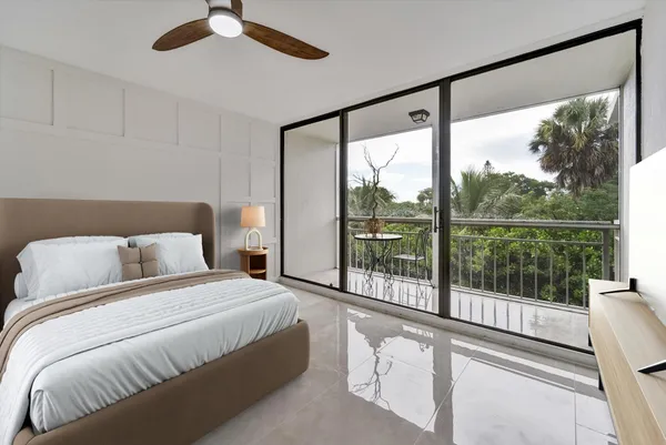 a bedroom with a large bed and a large window