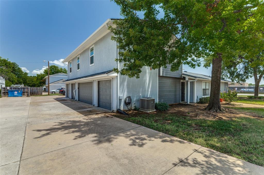 606 Ridgeline Drive Hurst, TX 76053 - Photo 1 of 1 a front view of a house with a yard and trees