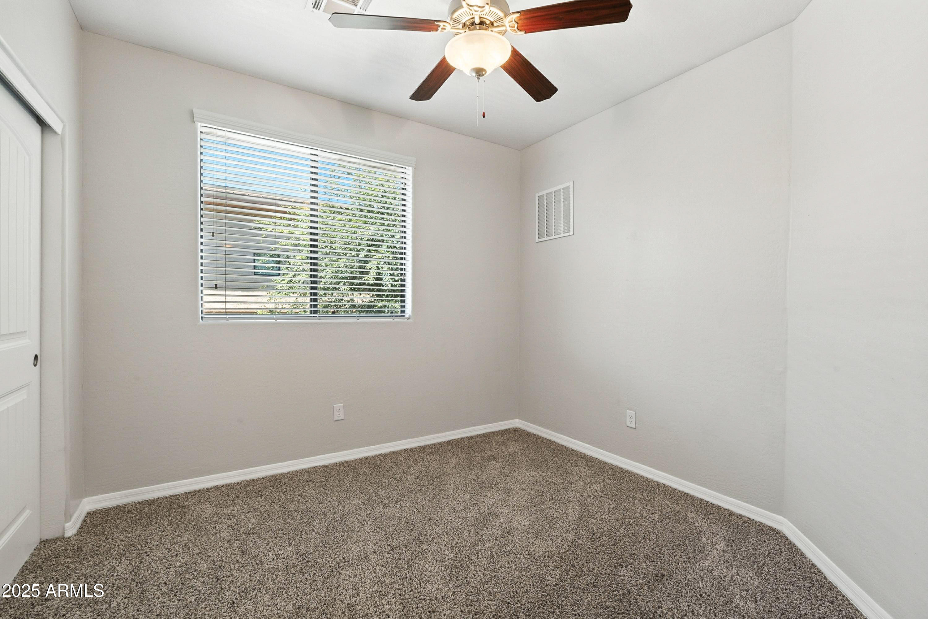 3330 South Gilbert Road, Unit 2066 Chandler, AZ 85286 - Photo 12 of 67 an empty room with a window