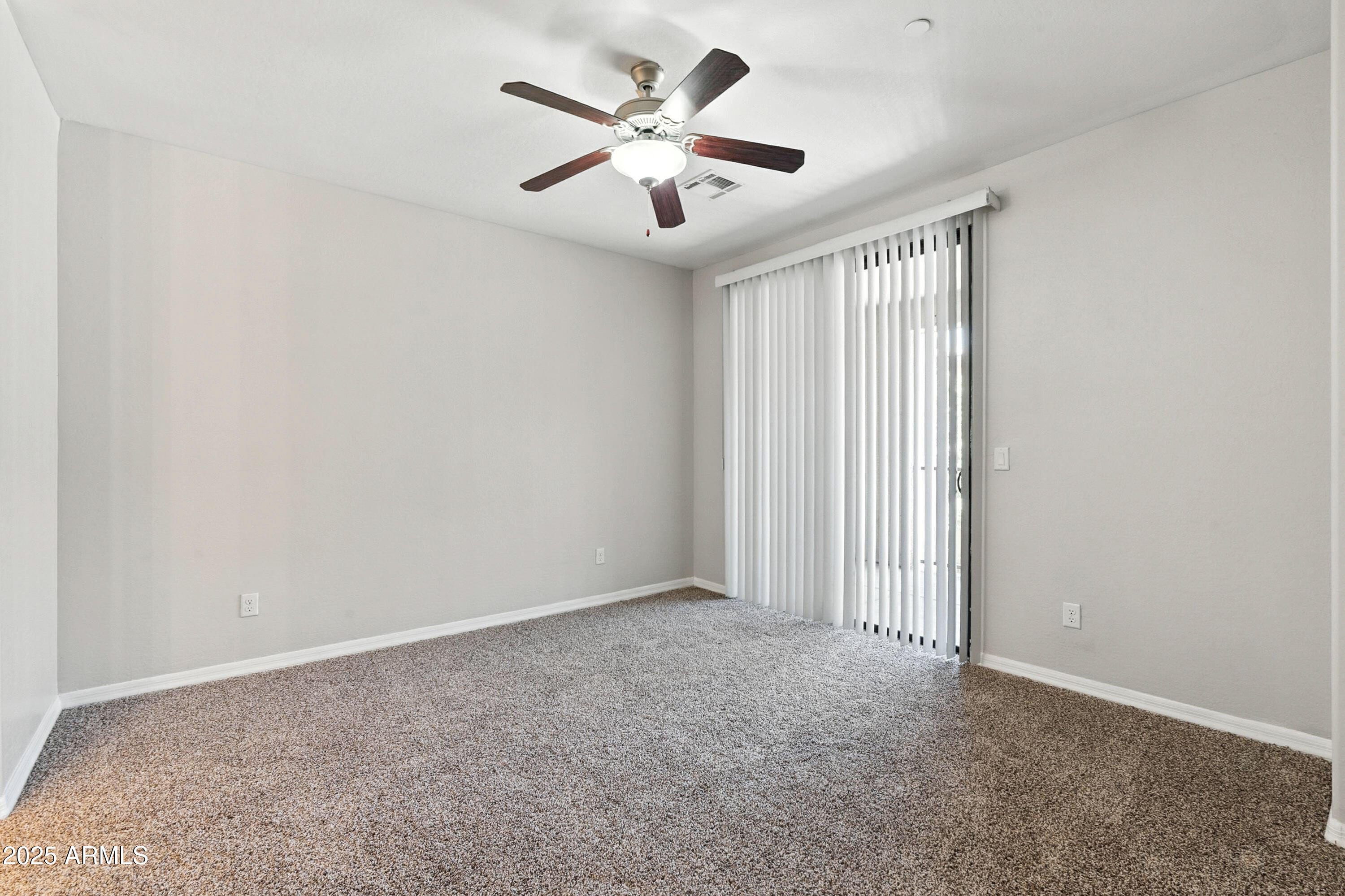 3330 South Gilbert Road, Unit 2066 Chandler, AZ 85286 - Photo 15 of 67 an empty room with windows and fan
