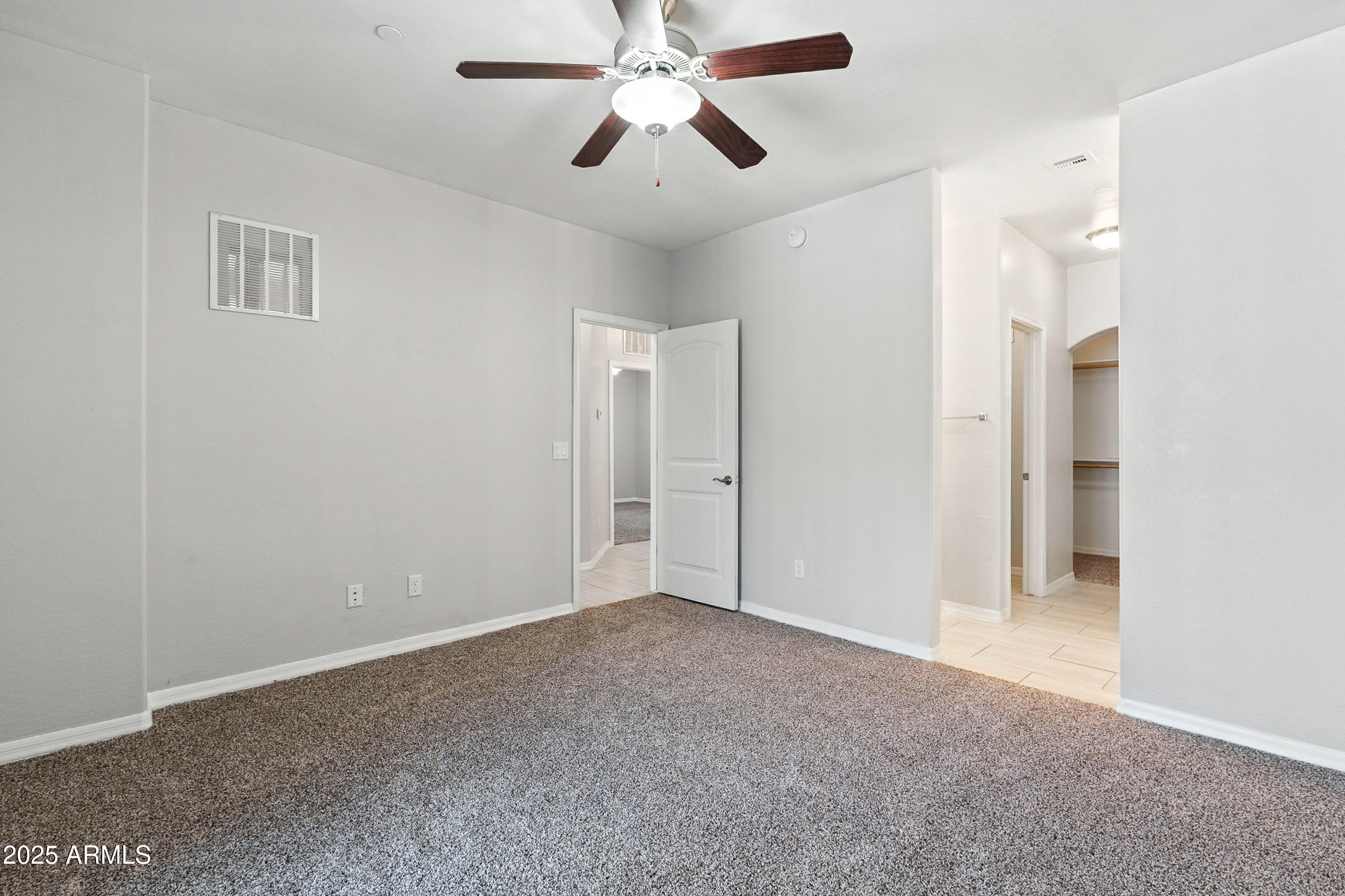 3330 South Gilbert Road, Unit 2066 Chandler, AZ 85286 - Photo 16 of 67 a view of an empty room and chandelier fan