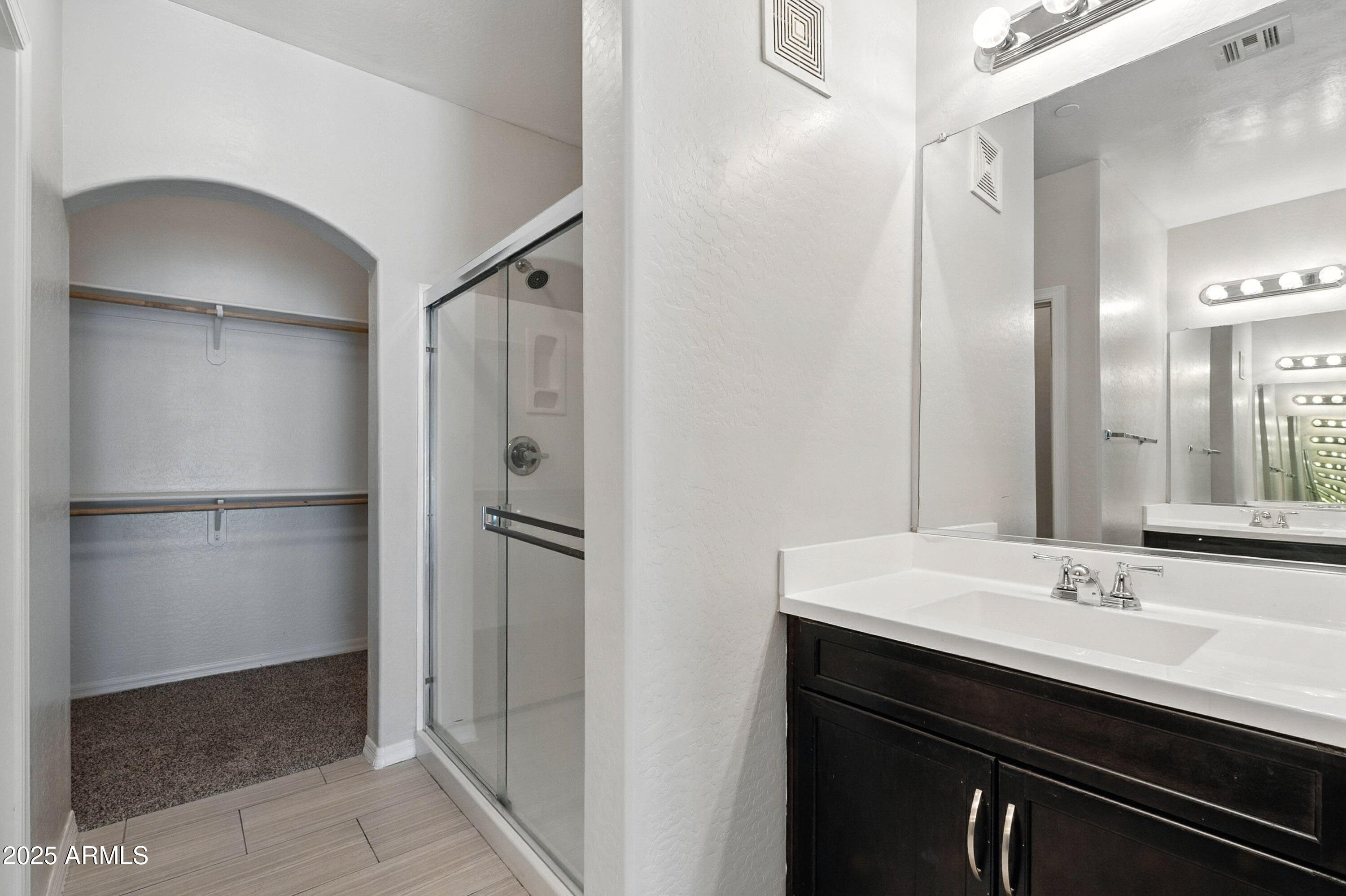3330 South Gilbert Road, Unit 2066 Chandler, AZ 85286 - Photo 17 of 67 a bathroom with a sink and mirror