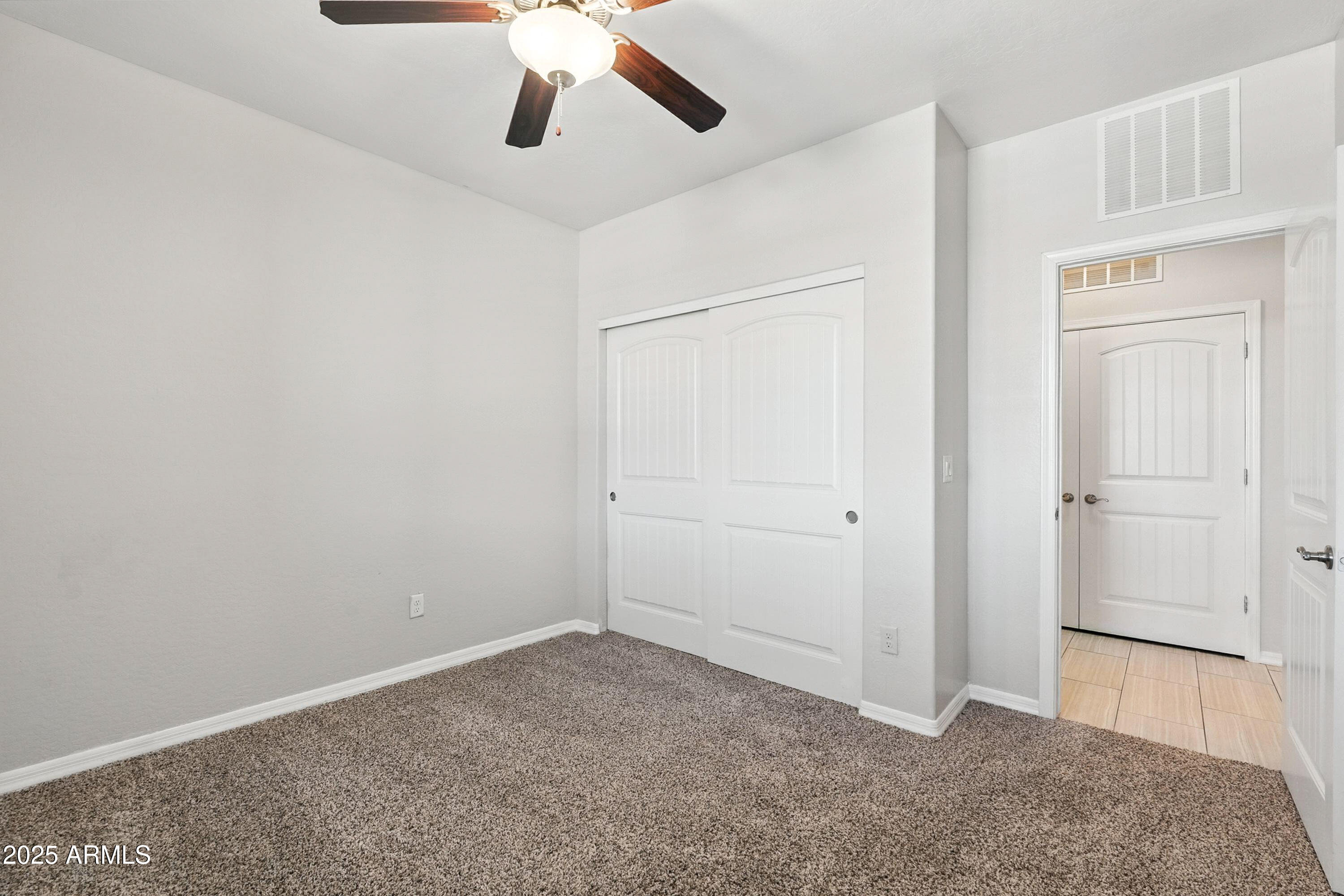 3330 South Gilbert Road, Unit 2066 Chandler, AZ 85286 - Photo 23 of 67 an empty room with closet and entryway