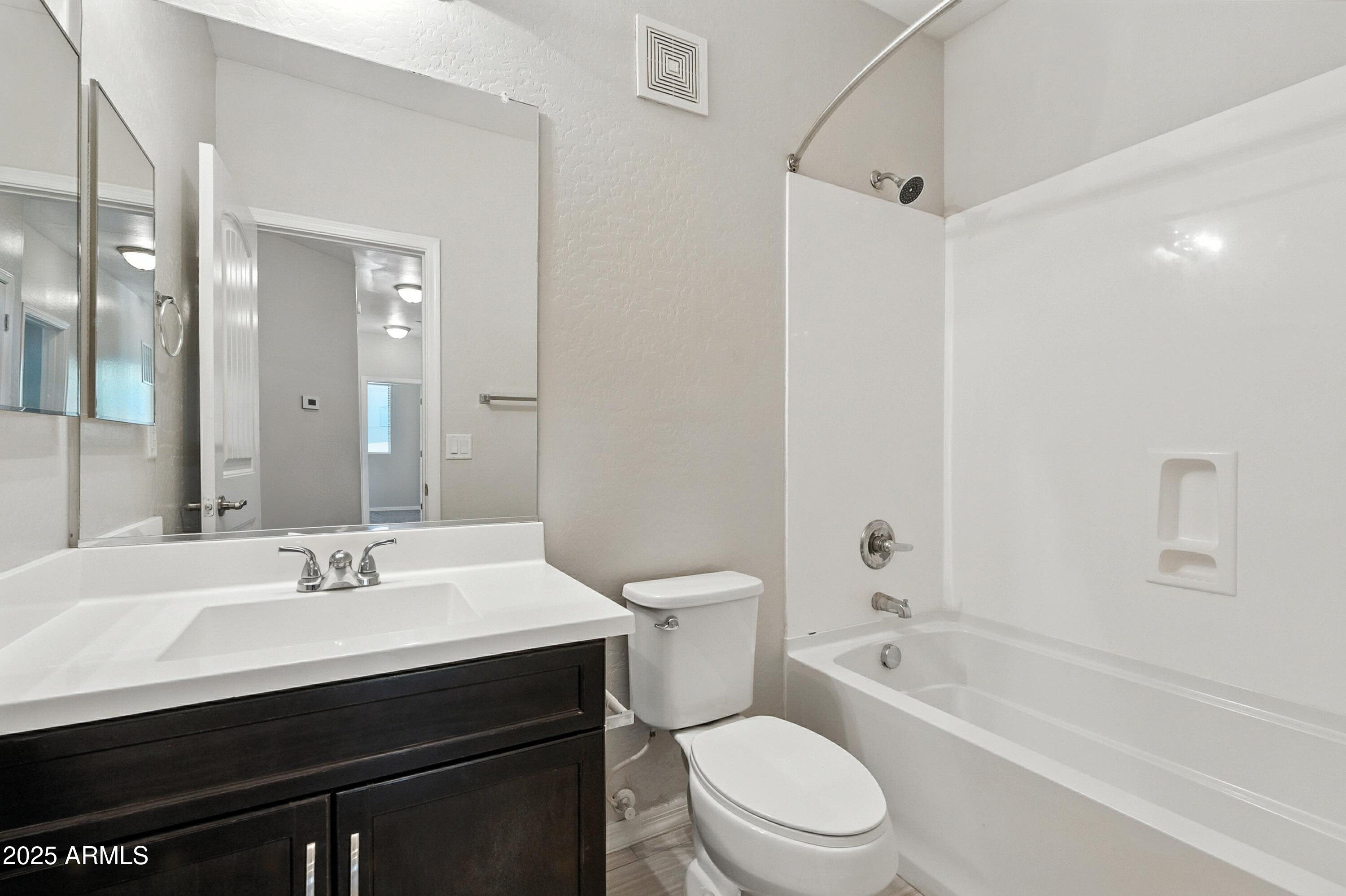 3330 South Gilbert Road, Unit 2066 Chandler, AZ 85286 - Photo 24 of 67 a bathroom with a sink a toilet and shower