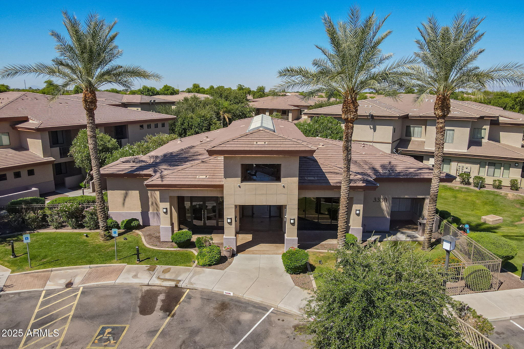 3330 South Gilbert Road, Unit 2066 Chandler, AZ 85286 - Photo 35 of 67 a front view of a house with a garden and a tree