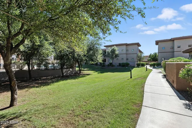 a view of a backyard with sitting area
