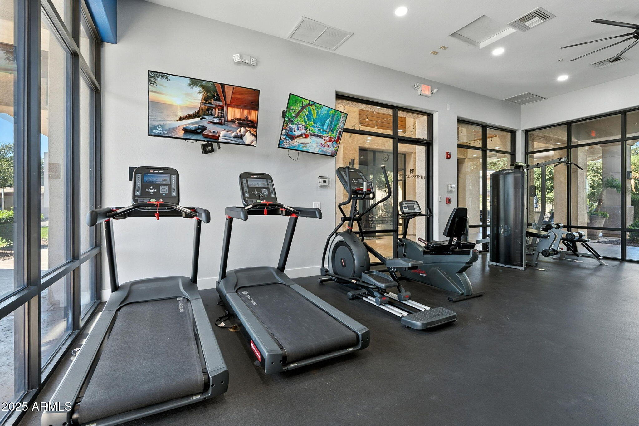 3330 South Gilbert Road, Unit 2066 Chandler, AZ 85286 - Photo 50 of 67 a room with gym equipment and a large window