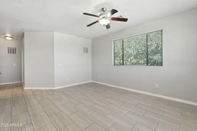 a view of kitchen with refrigerator and microwave