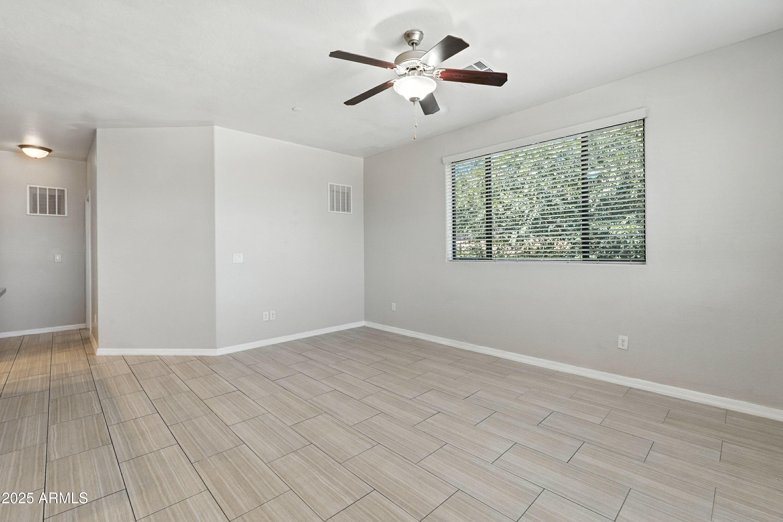 3330 South Gilbert Road, Unit 2066 Chandler, AZ 85286 - Photo 5 of 67 a view of an empty room with a window