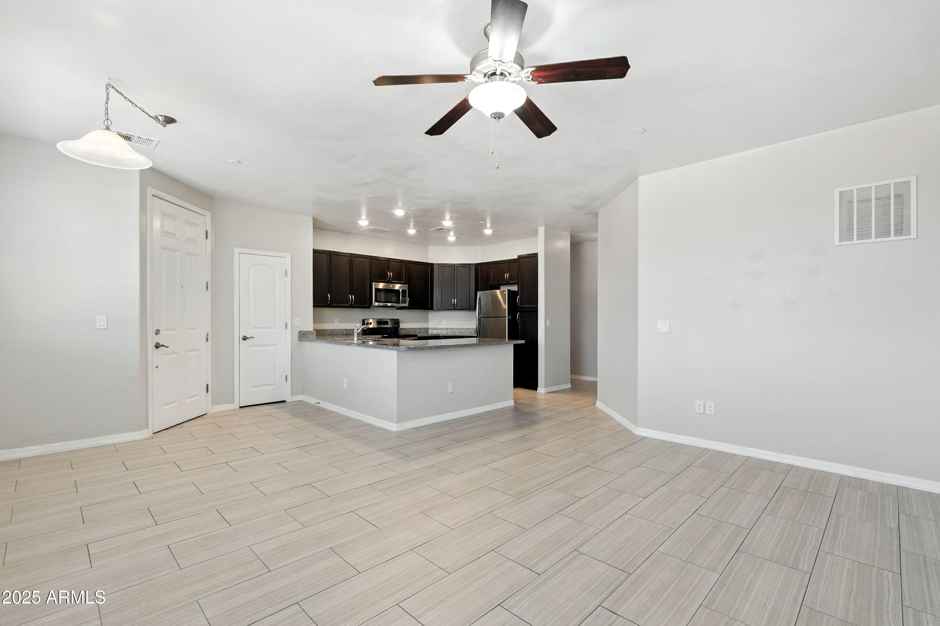 3330 South Gilbert Road, Unit 2066 Chandler, AZ 85286 - Photo 6 of 67 a view of kitchen with refrigerator and microwave