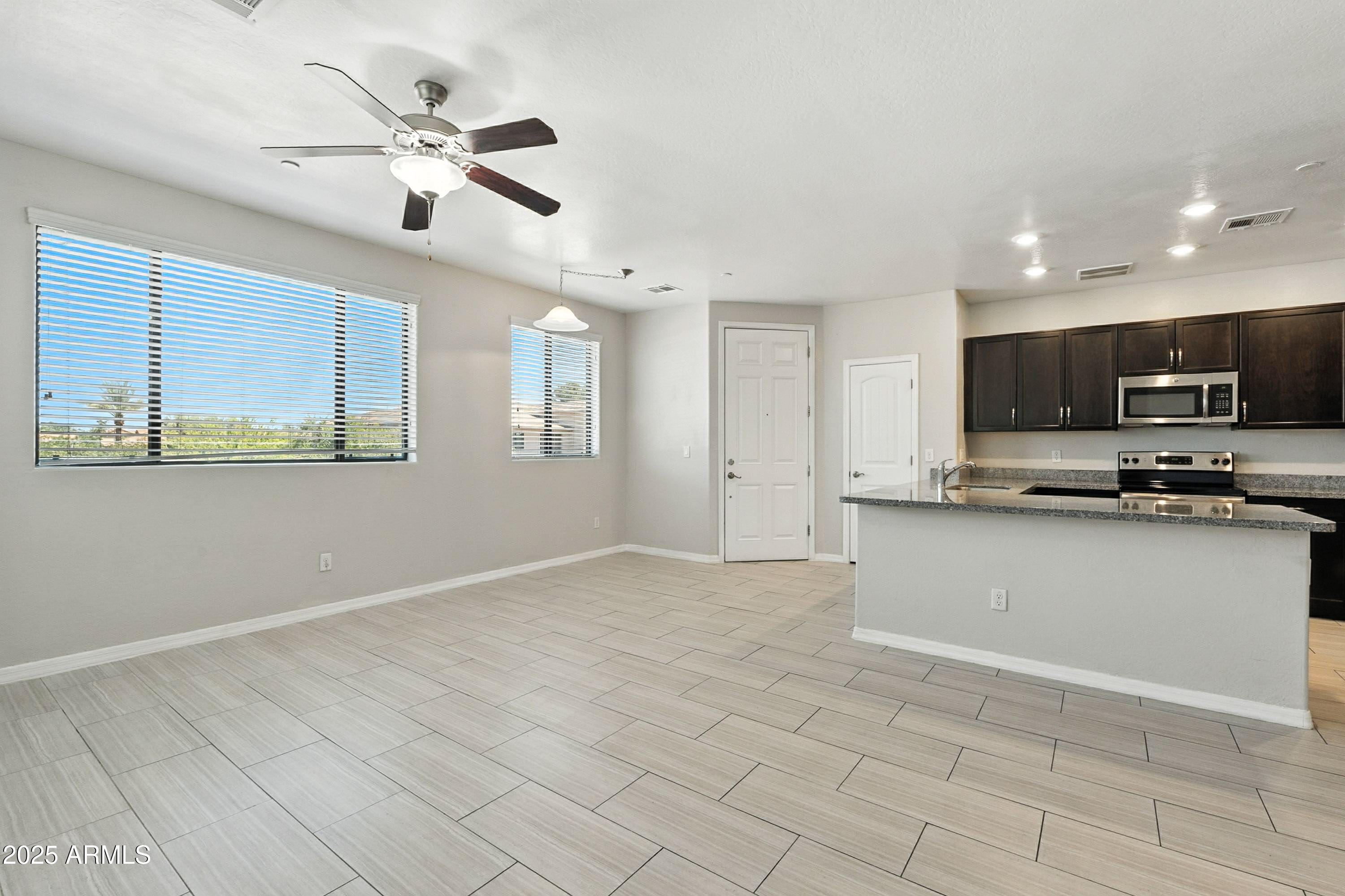 3330 South Gilbert Road, Unit 2066 Chandler, AZ 85286 - Photo 7 of 67 a view of a kitchen with microwave and cabinets