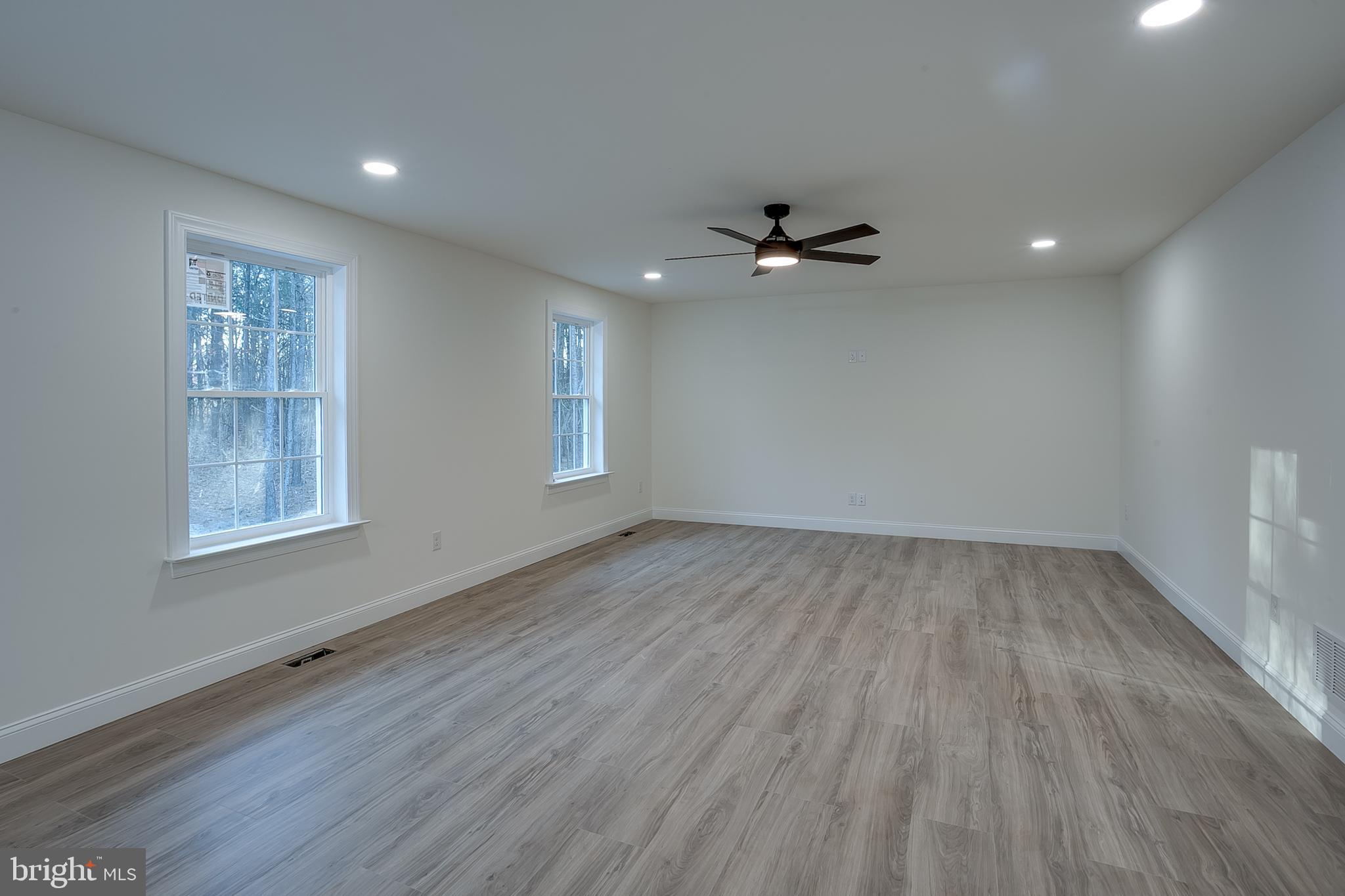 1427 Williamstown Erial Road Sicklerville, NJ 08081 - Photo 15 of 27 wooden floor in an empty room with a window