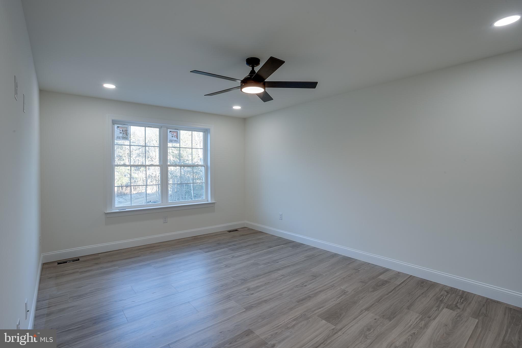 1427 Williamstown Erial Road Sicklerville, NJ 08081 - Photo 19 of 27 wooden floor in an empty room with a window