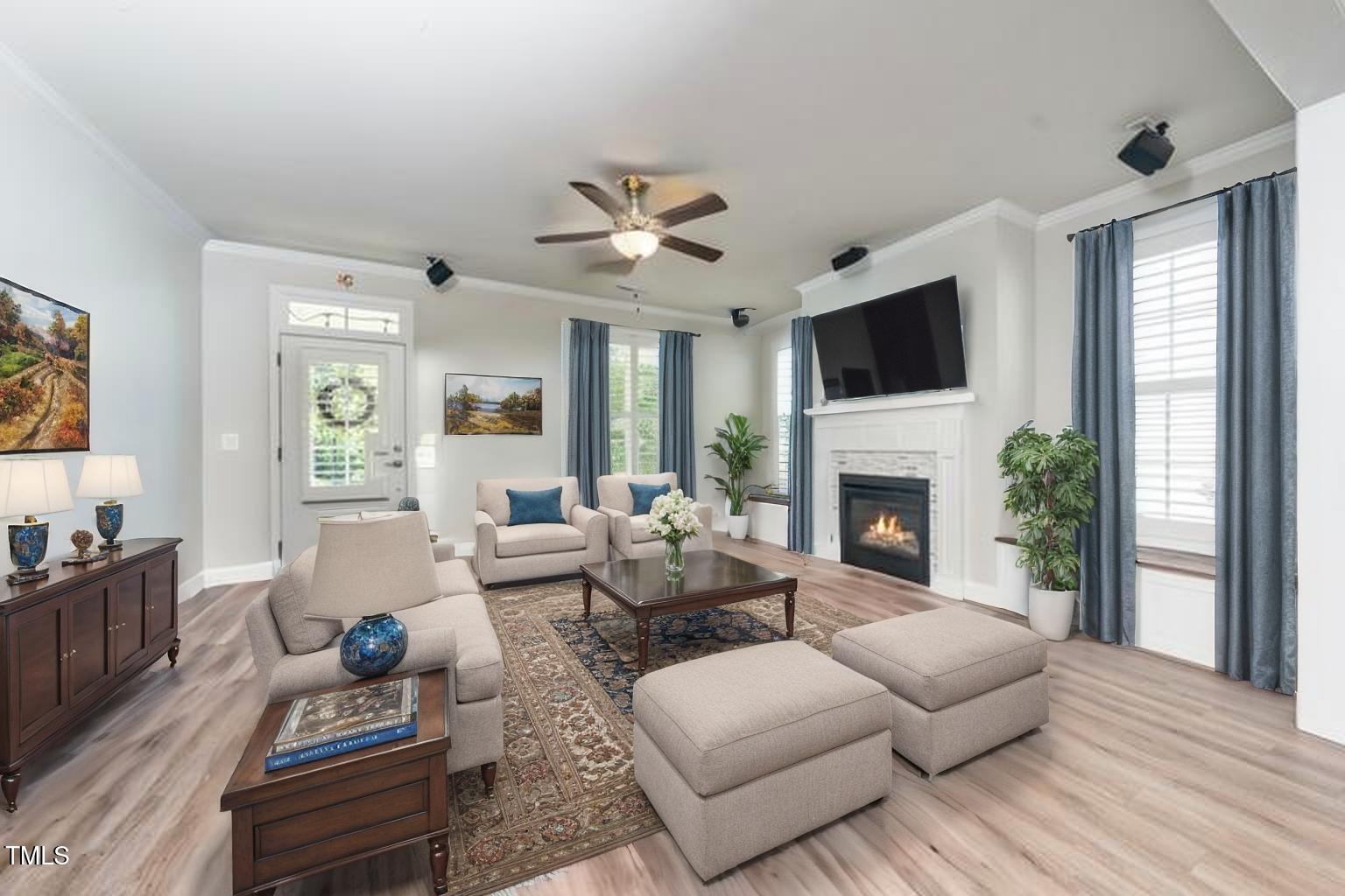 1705 Main Divide Drive Wake Forest, NC 27587 - Photo 12 of 47 a living room with furniture fireplace and a flat screen tv