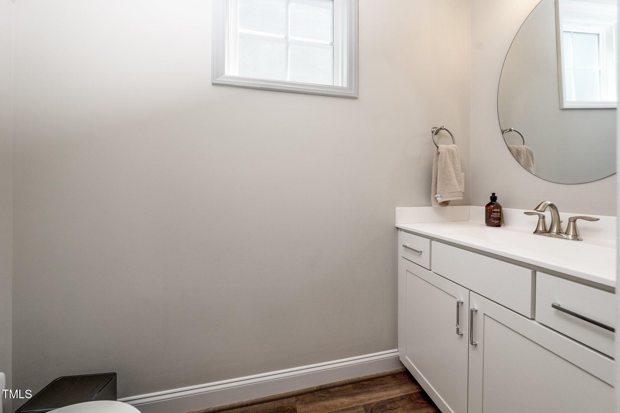 1705 Main Divide Drive Wake Forest, NC 27587 - Photo 16 of 47 a bathroom with a sink and a mirror