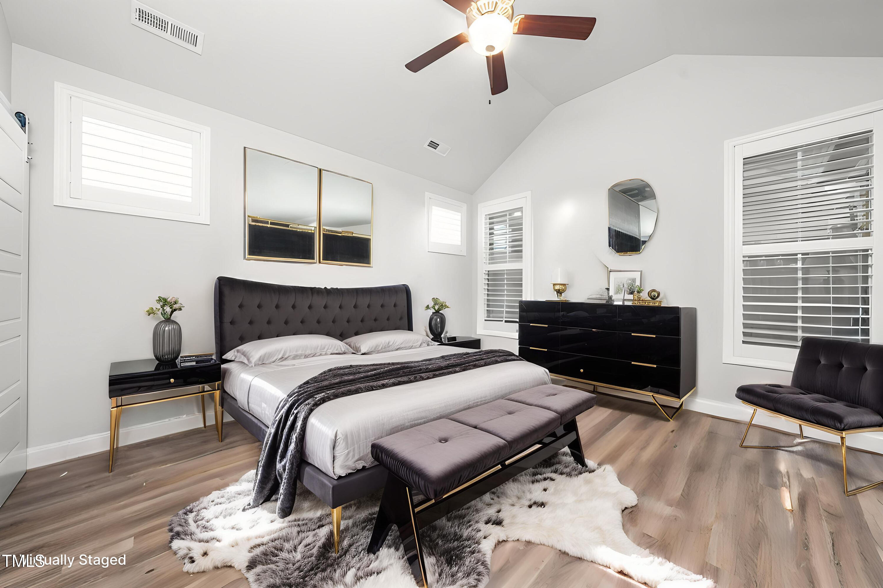 1705 Main Divide Drive Wake Forest, NC 27587 - Photo 17 of 47 a spacious bedroom with a bed and ceiling fan
