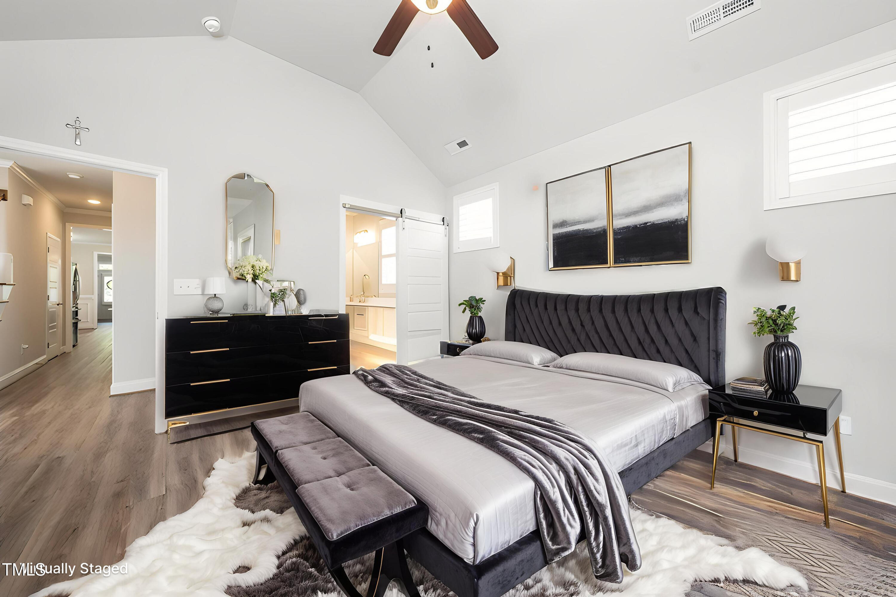 1705 Main Divide Drive Wake Forest, NC 27587 - Photo 18 of 47 a spacious bedroom with a bed and a chandelier