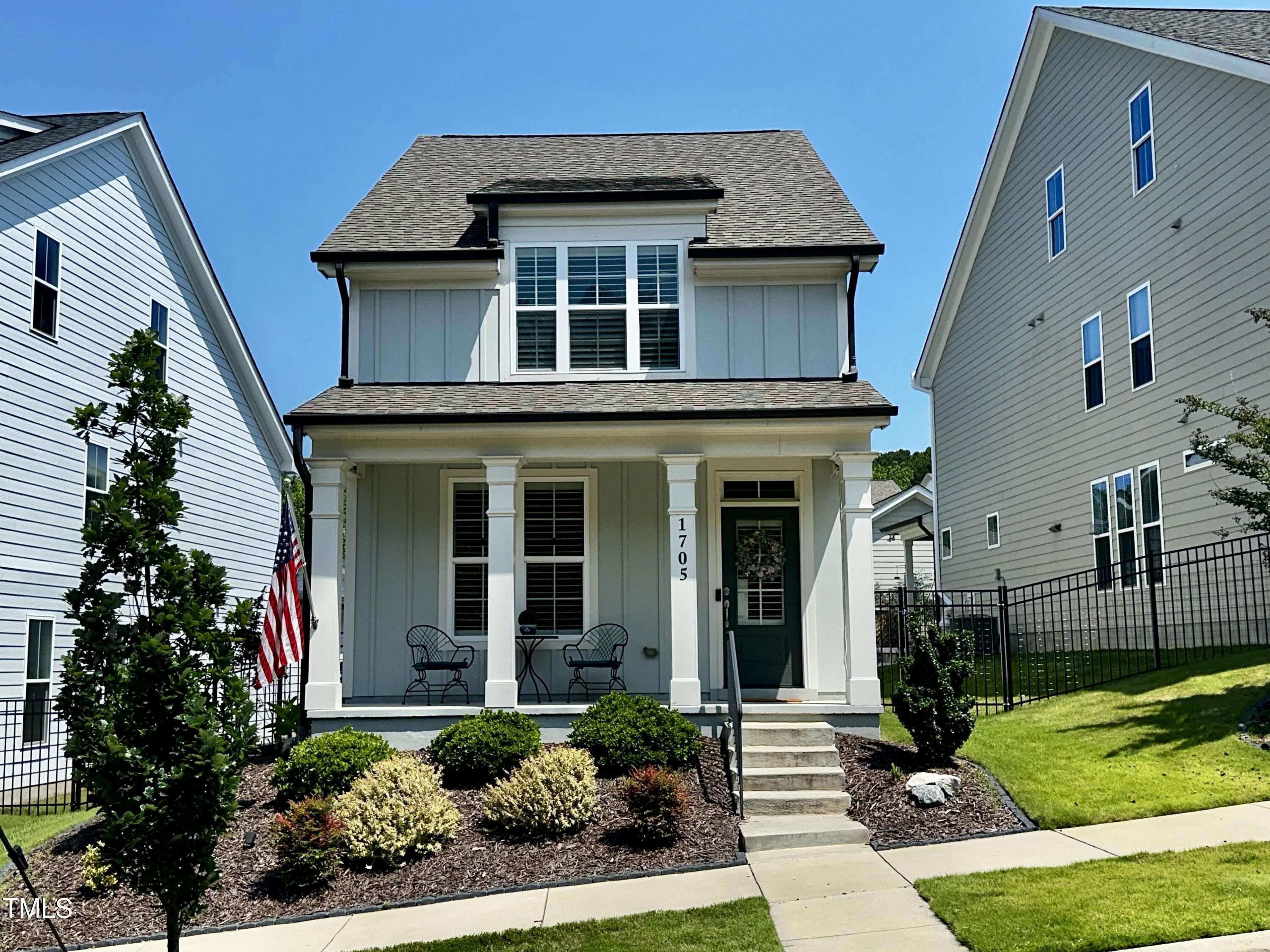 1705 Main Divide Drive Wake Forest, NC 27587 - Photo 2 of 47 a front view of a house with a yard