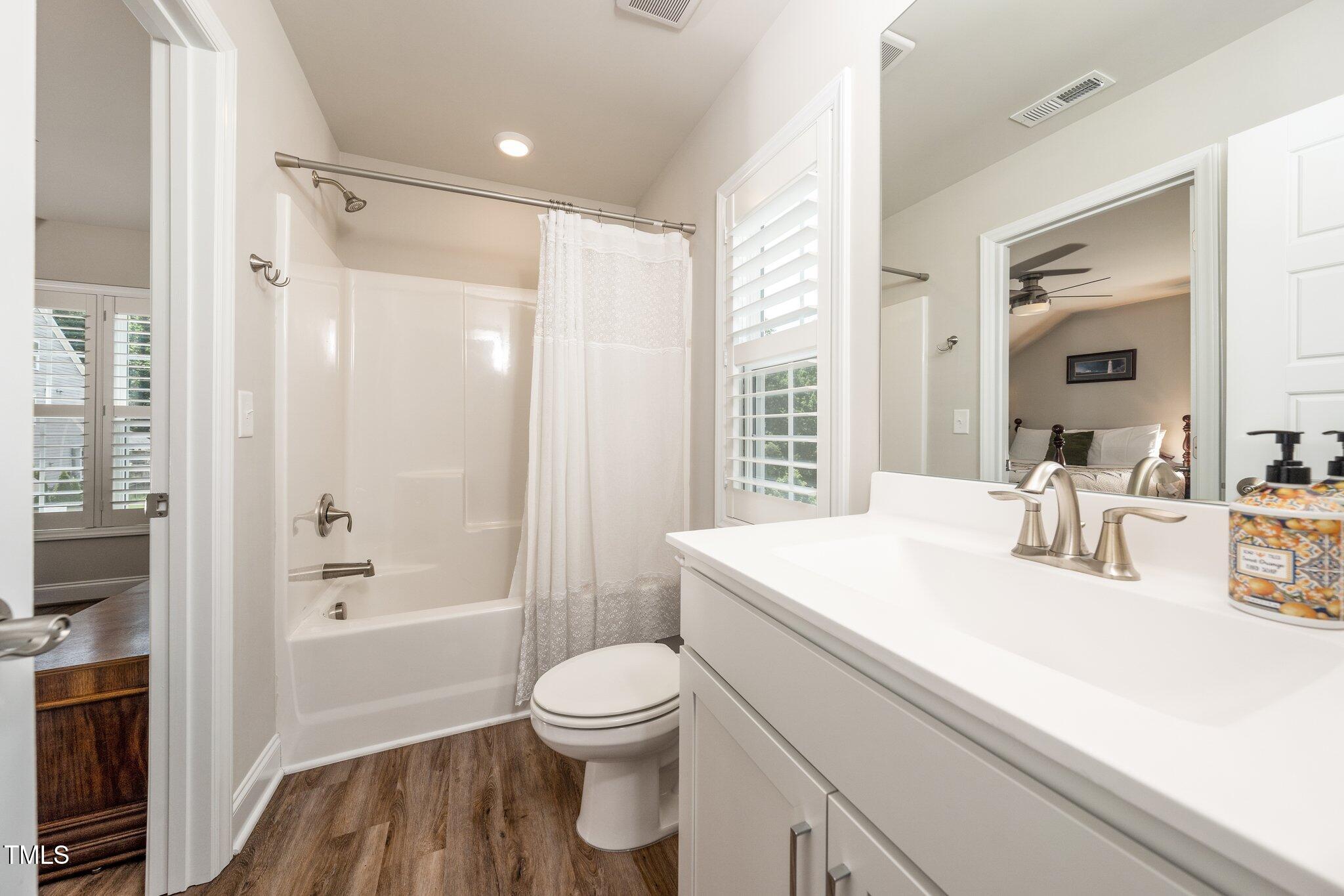 1705 Main Divide Drive Wake Forest, NC 27587 - Photo 30 of 47 a bathroom with a sink a toilet a tub and shower
