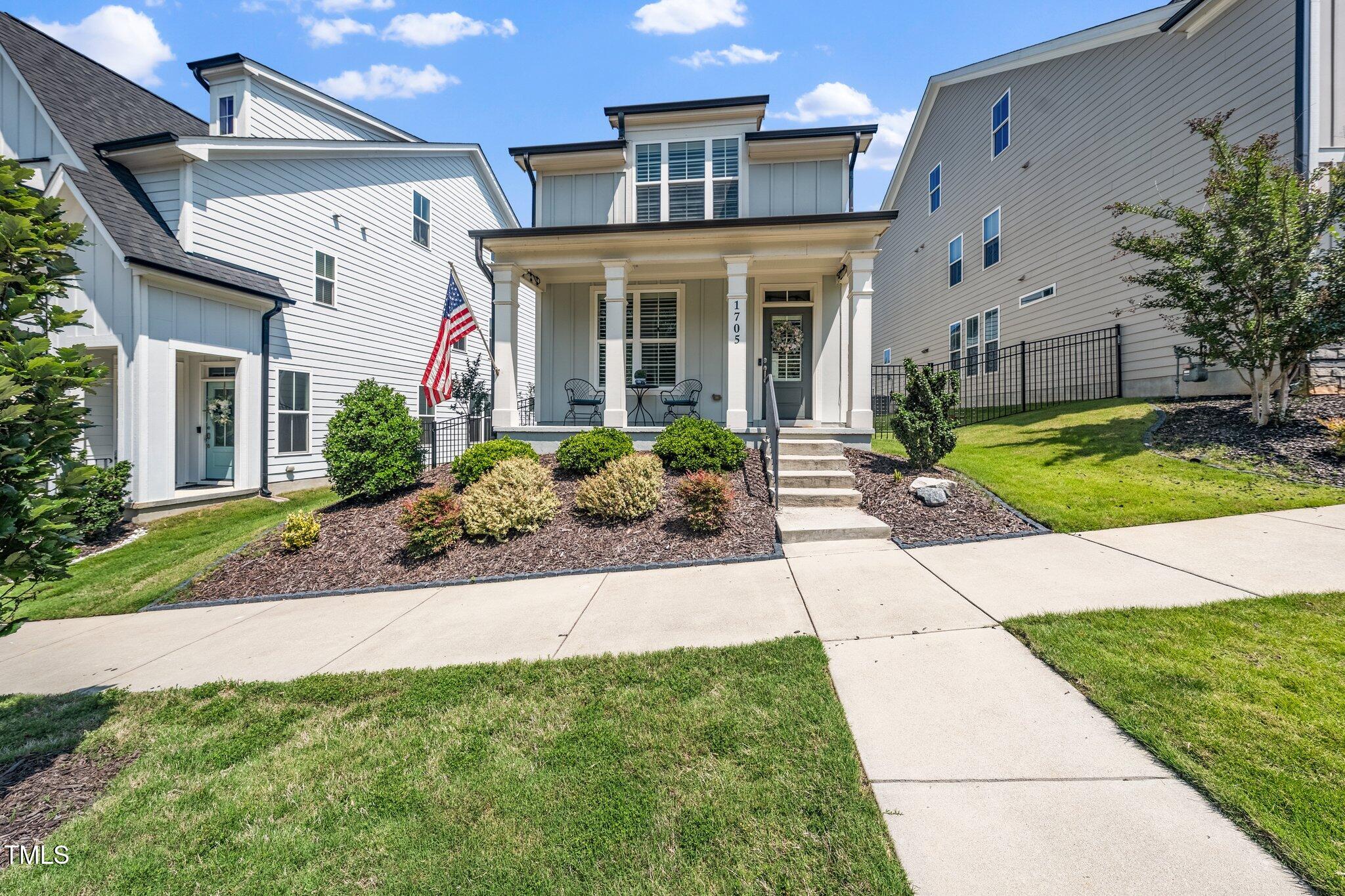 1705 Main Divide Drive Wake Forest, NC 27587 - Photo 38 of 47 a front view of a house with garden