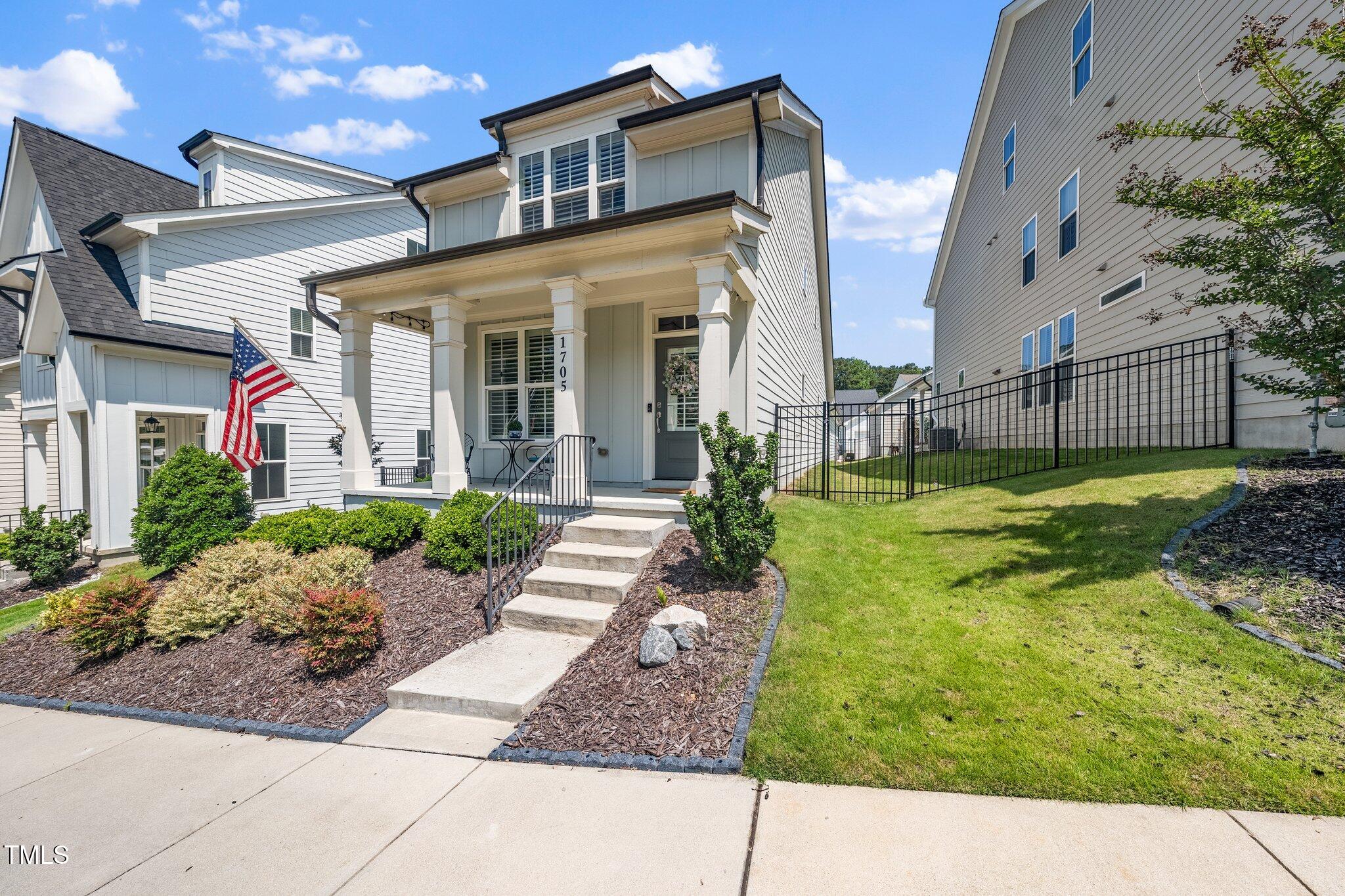 1705 Main Divide Drive Wake Forest, NC 27587 - Photo 40 of 47 a backyard of a house with garden and plants