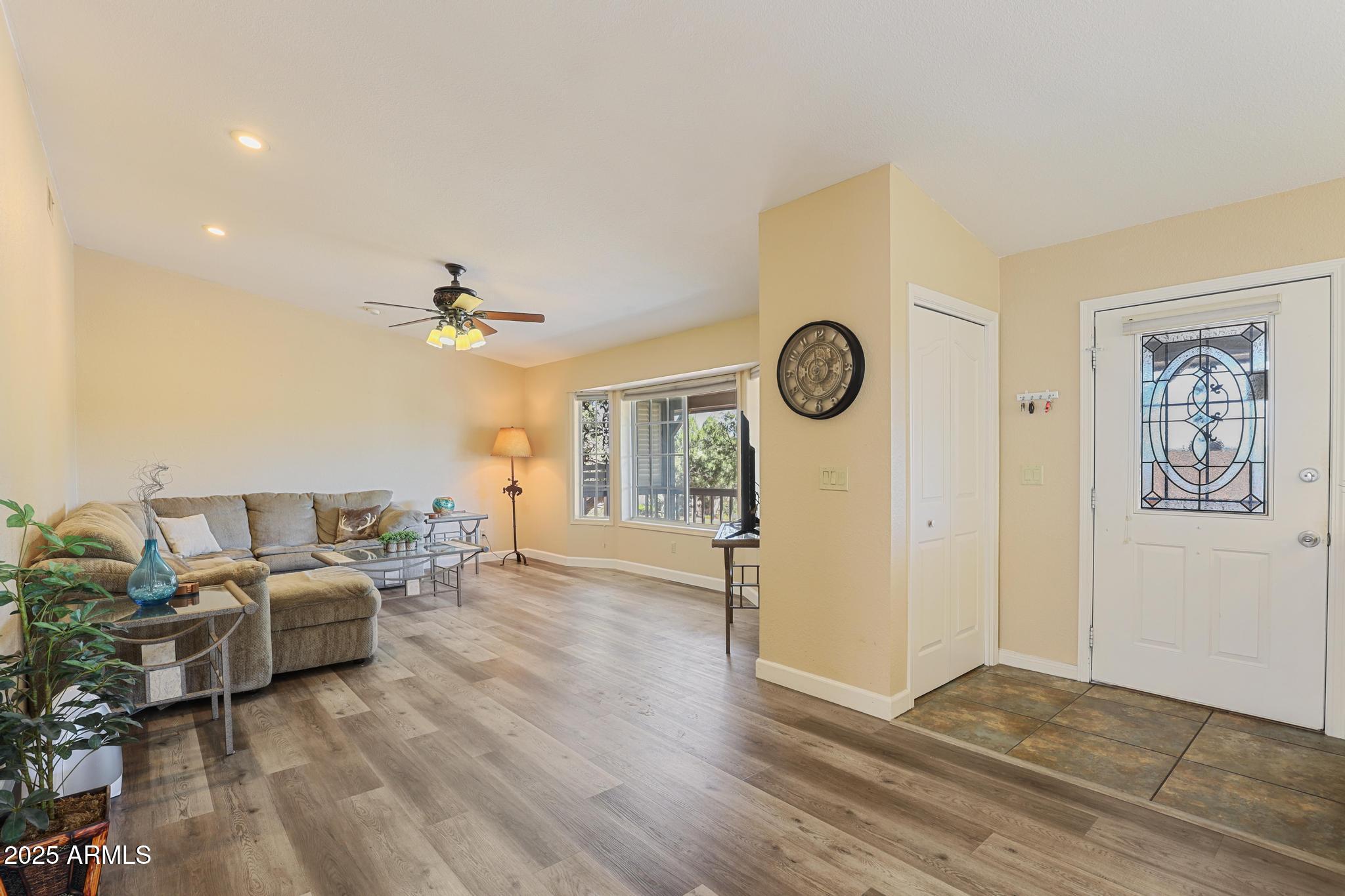 1101 North Monte Rosa Lane Payson, AZ 85541 - Photo 13 of 35 a living room with furniture and a wooden floor